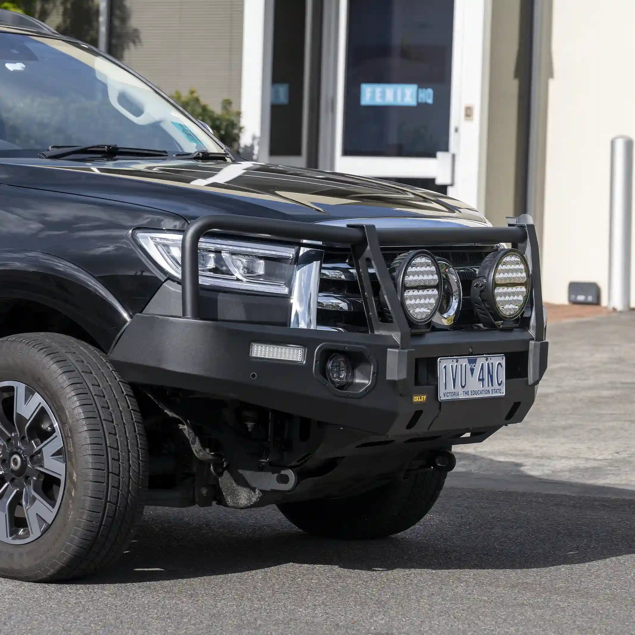 left installed view oxley bull bar fitted to gwm cannon 2019 on with winch compatibility recovery points and driving light mounts elevated 4x4