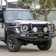 left installed oxley bull bar on toyota landcruiser 79 series dual cab 2024 with jacking points antenna tabs and rugged finish from elevated 4x4