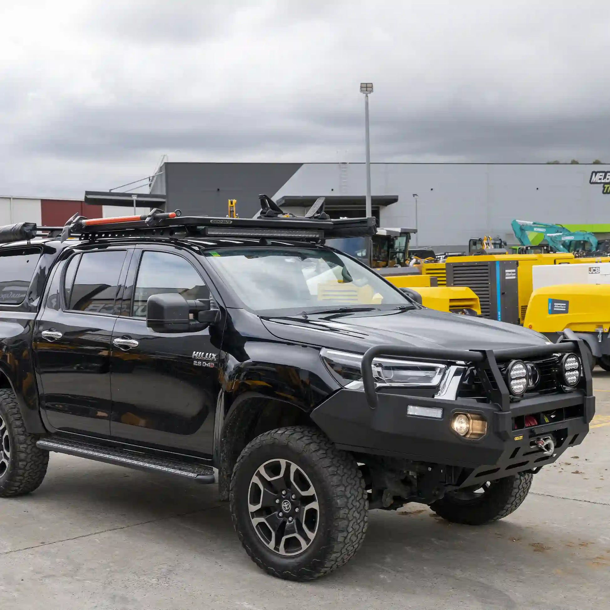 left installed oxley fleet bull bar fitted to toyota hilux with winch compatibility and recovery points elevated 4x4