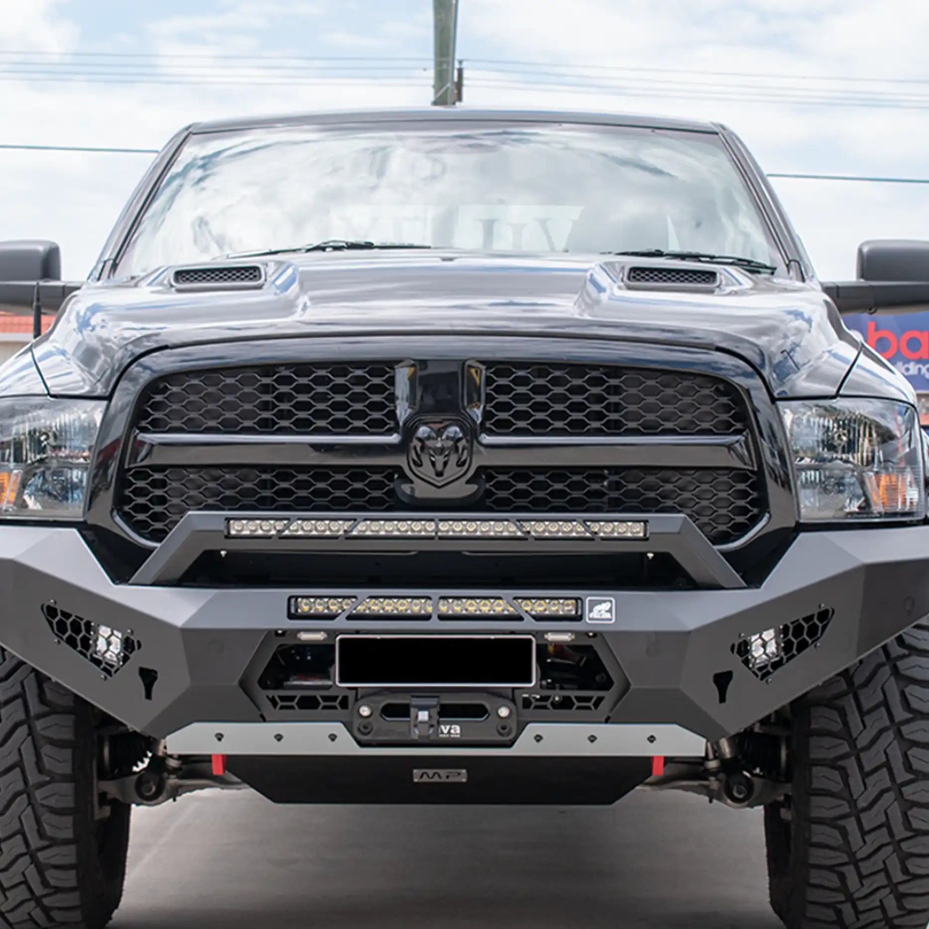 Close-up front view of the Offroad Animal Predator Bull Bar fitted to a Ram 1500 DS, highlighting the precise matte-black powder coating and integrated LED light bar compatibility. Engineered by Elevated 4x4, this bar delivers premium strength, modern style, and easy winch mounting for 4WD touring excellence.