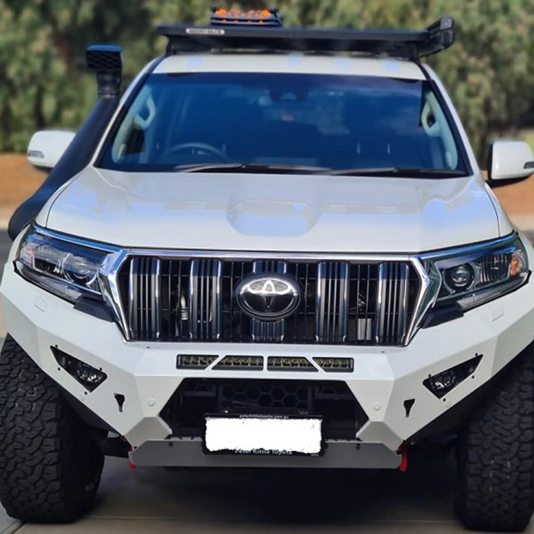 Front view of the Offroad Animal Predator Bull Bar on a Toyota Prado 150 Series, showing its aggressive design, integrated LED light bar mount, and matte black finish. Expertly installed by Elevated 4x4, this setup enhances airflow, winch access, and durability for off-road performance across Newcastle and the Hunter Valley.