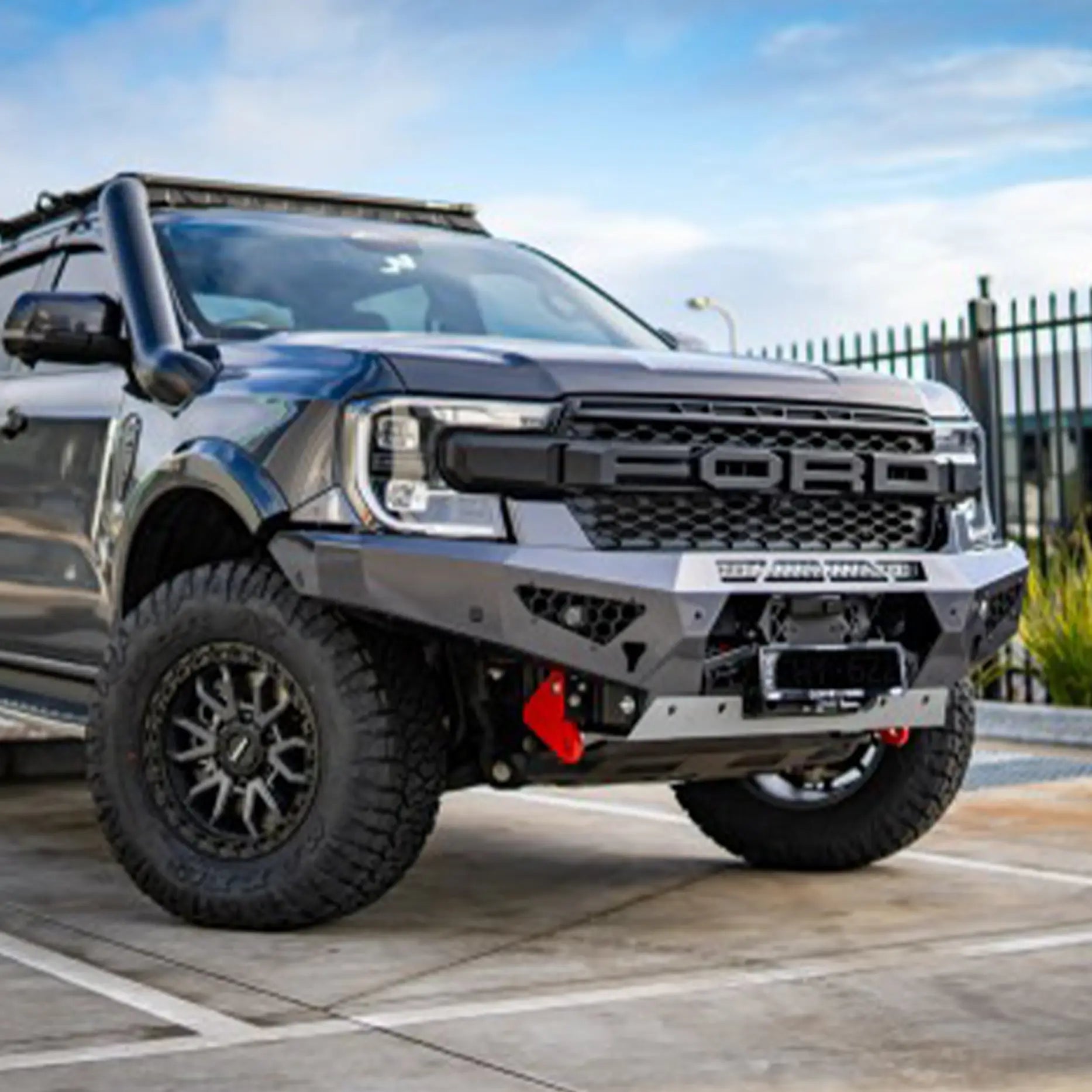 Left-angle view of the Offroad Animal Predator Bull Bar fitted to a Ford Ranger Raptor, highlighting its tight, lightweight profile and perfect alignment with factory body lines. This premium bar from Elevated 4x4 delivers outstanding protection, modern styling, and aerodynamic design while maintaining superior performance on and off-road.