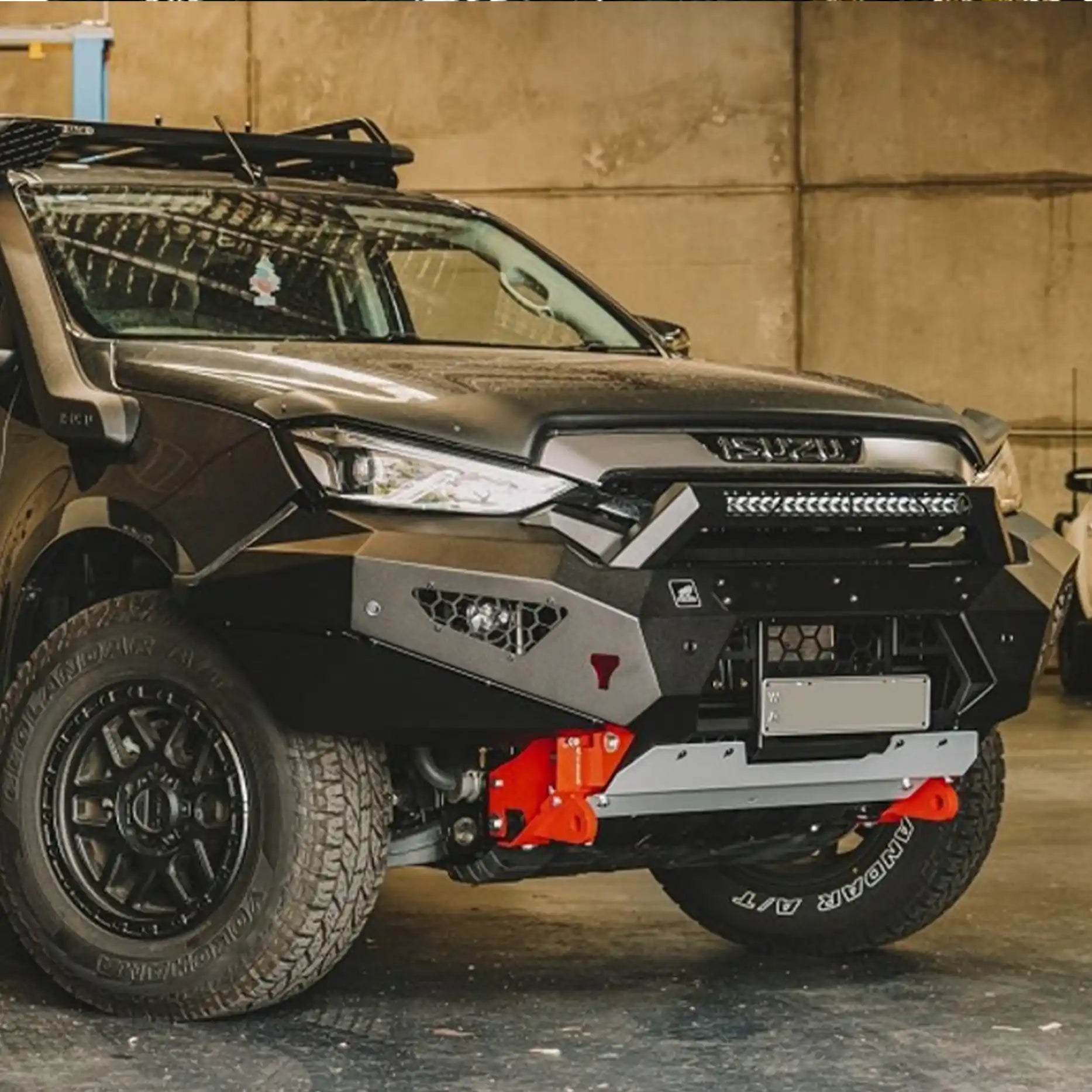 Left-angle view of the Offroad Animal Predator Bull Bar on a 2021–2024 Isuzu MU-X featuring integrated LED light fitment and recovery points. Installed by Elevated 4x4, this bar delivers maximum strength, precision airflow, and superior night visibility — proving that rugged protection can still look sleek and modern.