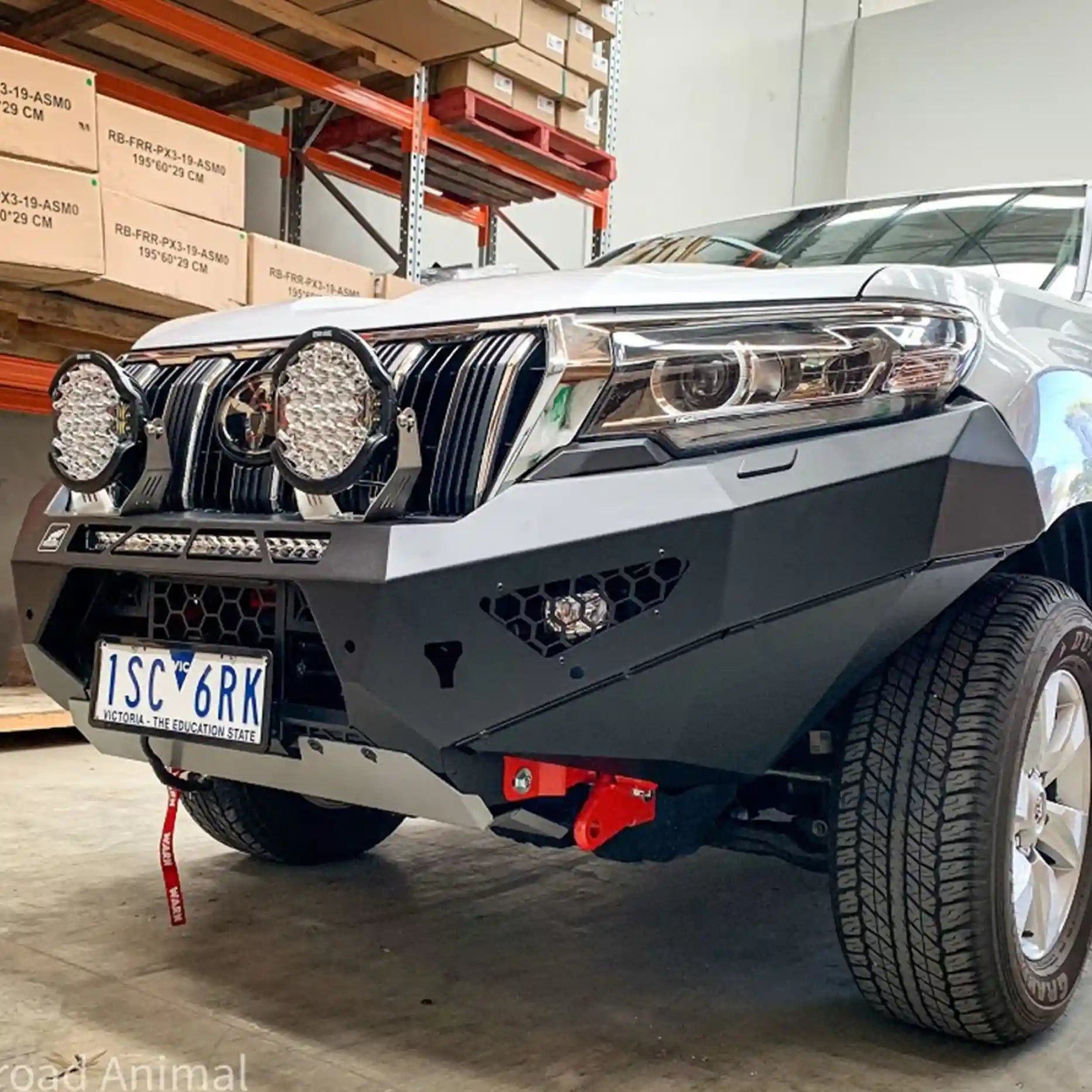 Left close-up of the Offroad Animal Predator Bull Bar installed on a Toyota Prado 150 Series, showcasing recovery points, bash plate integration, and matte black texture. Professionally fitted by Elevated 4x4, it offers unmatched strength and a bold look for Hunter Region adventurers.