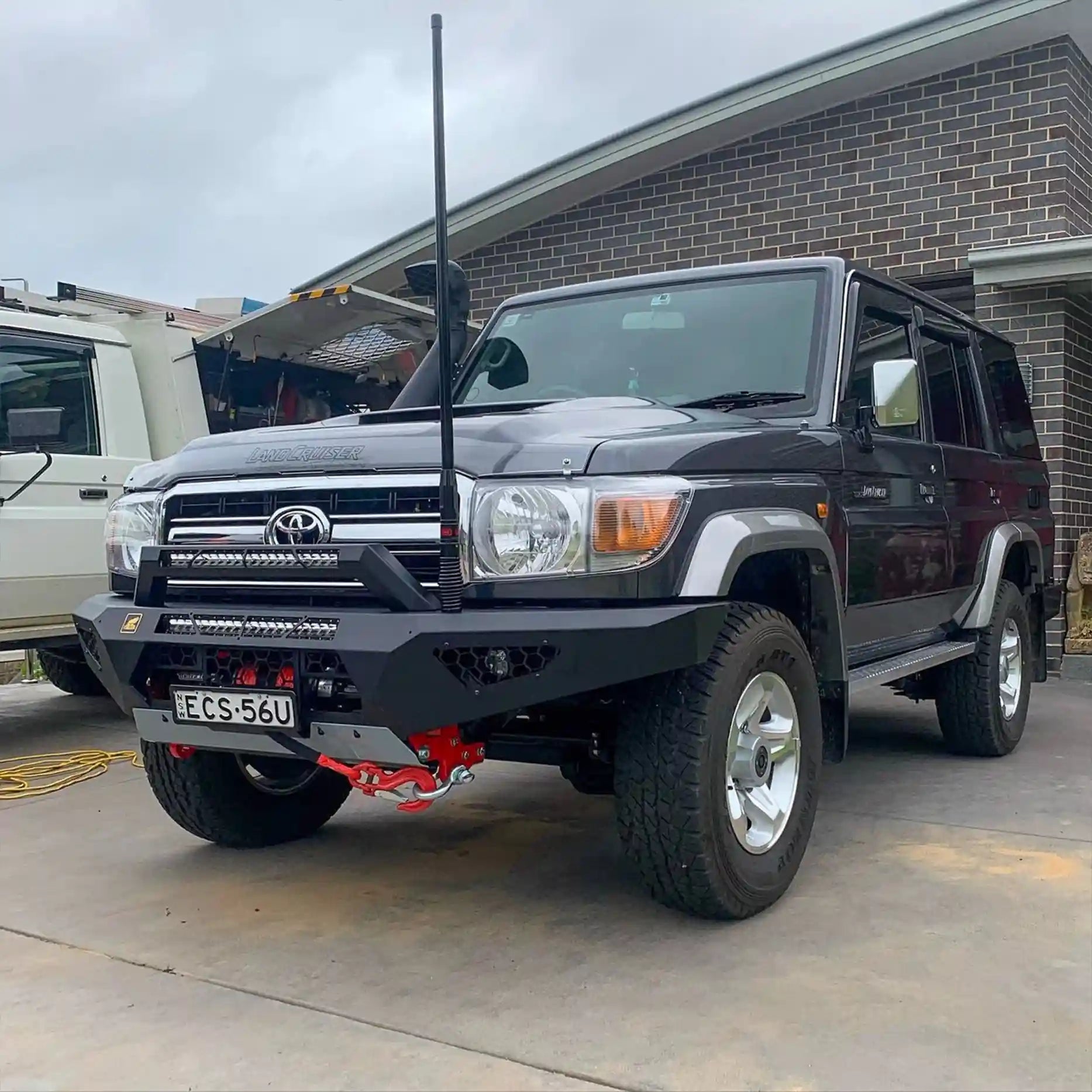 Left profile view of the Offroad Animal Predator Bull Bar on a Toyota Land Cruiser 76 Series, featuring welded steel construction, perfect airflow, and stealth LED compatibility. Elevated 4x4 delivers unmatched build quality and durability for touring and trail adventures in Port Stephens and Nelson Bay.