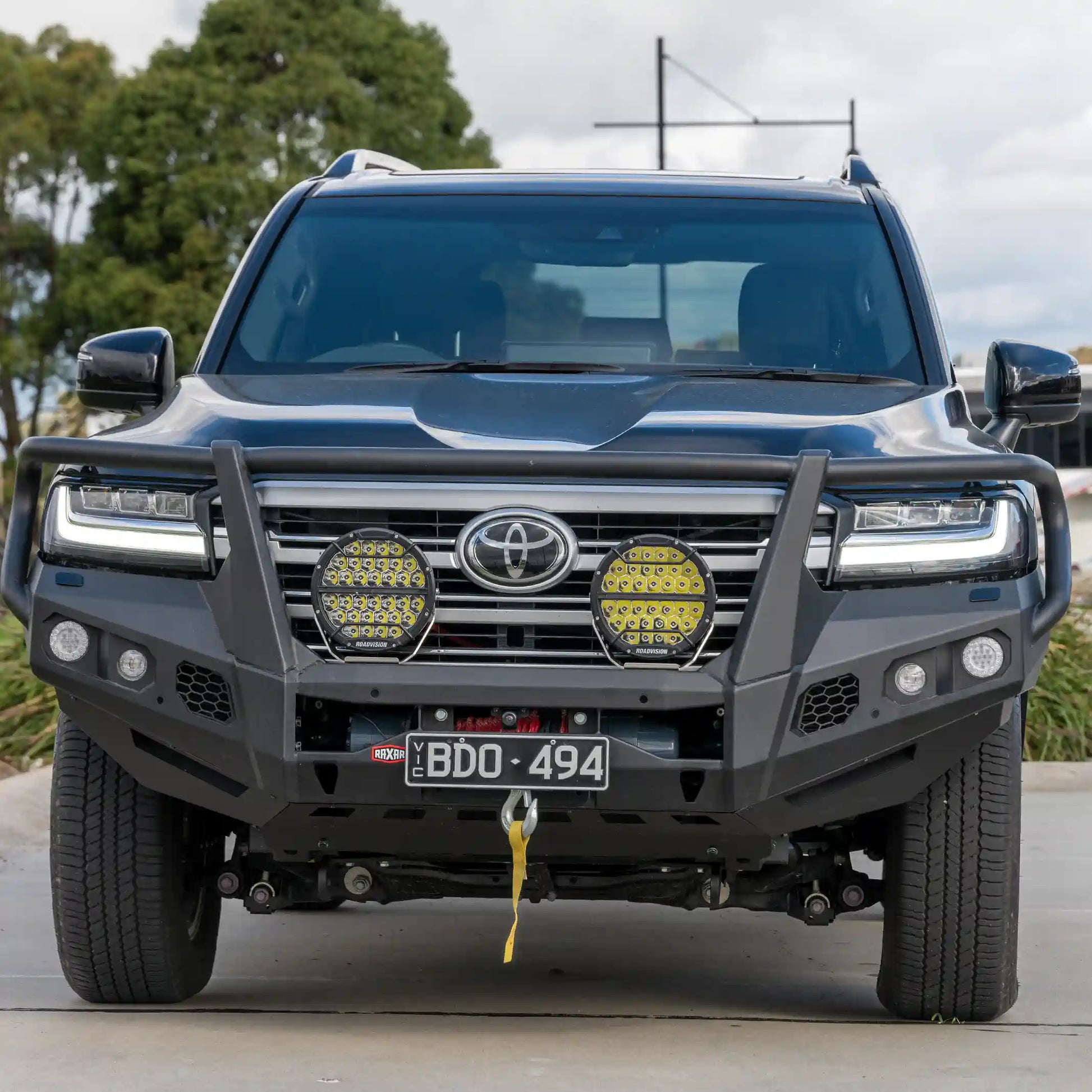 The Toyota LandCruiser 300 front-installed looped bull bar from Elevated 4x4 delivers tough off-road protection and a bold matte black finish. With winch compatibility, recovery points, and ADR compliance, this RAXAR bull bar is built for Australian 4WD conditions and provides unmatched safety and performance.