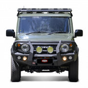 front installed view of raxar looped bull bar fitted to suzuki jimny showcasing adr compliant bumper replacement design matte black powder coated finish integrated fog lights and full winch compatibility tough offroad protection supplied by elevated 4x4