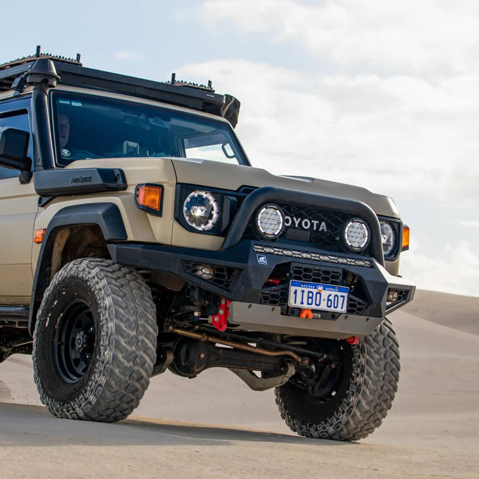 Right side angle of the Offroad Animal Predator Bull Bar on a Toyota Land Cruiser 76 Series facelift model, showcasing precision fitment and aerodynamic styling. Designed and supplied by Elevated 4x4, this premium bar provides unmatched durability and standout looks throughout Port Stephens and the Hunter Valley.