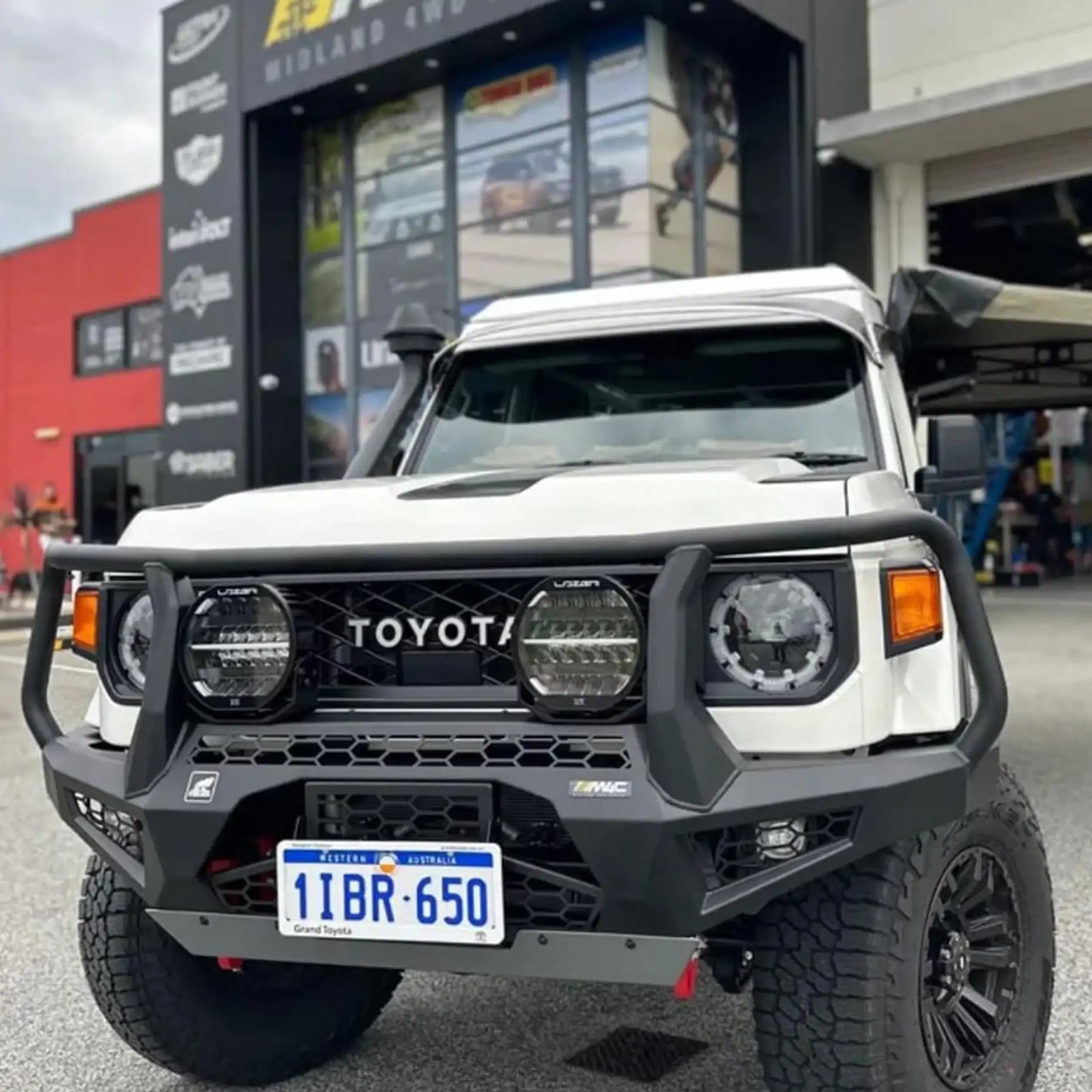 Right side angle of the Offroad Animal Toro Bull Bar on a Toyota Land Cruiser 79 Series facelift model, capturing its one-piece construction and compact design that enhances airflow and durability. Designed and installed by Elevated 4x4, this bar provides unmatched protection and style across Port Stephens and Newcastle.