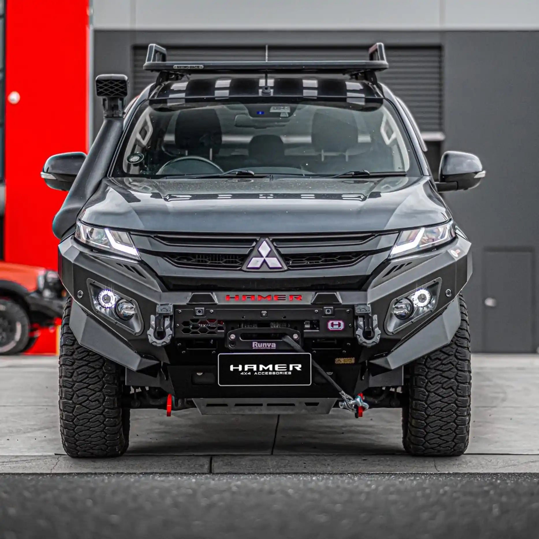 Rugged front angle of Mitsubishi Triton MR (2018–Present) fitted with Hamer King Series Bull Bar in matte black, winch ready with recovery points.