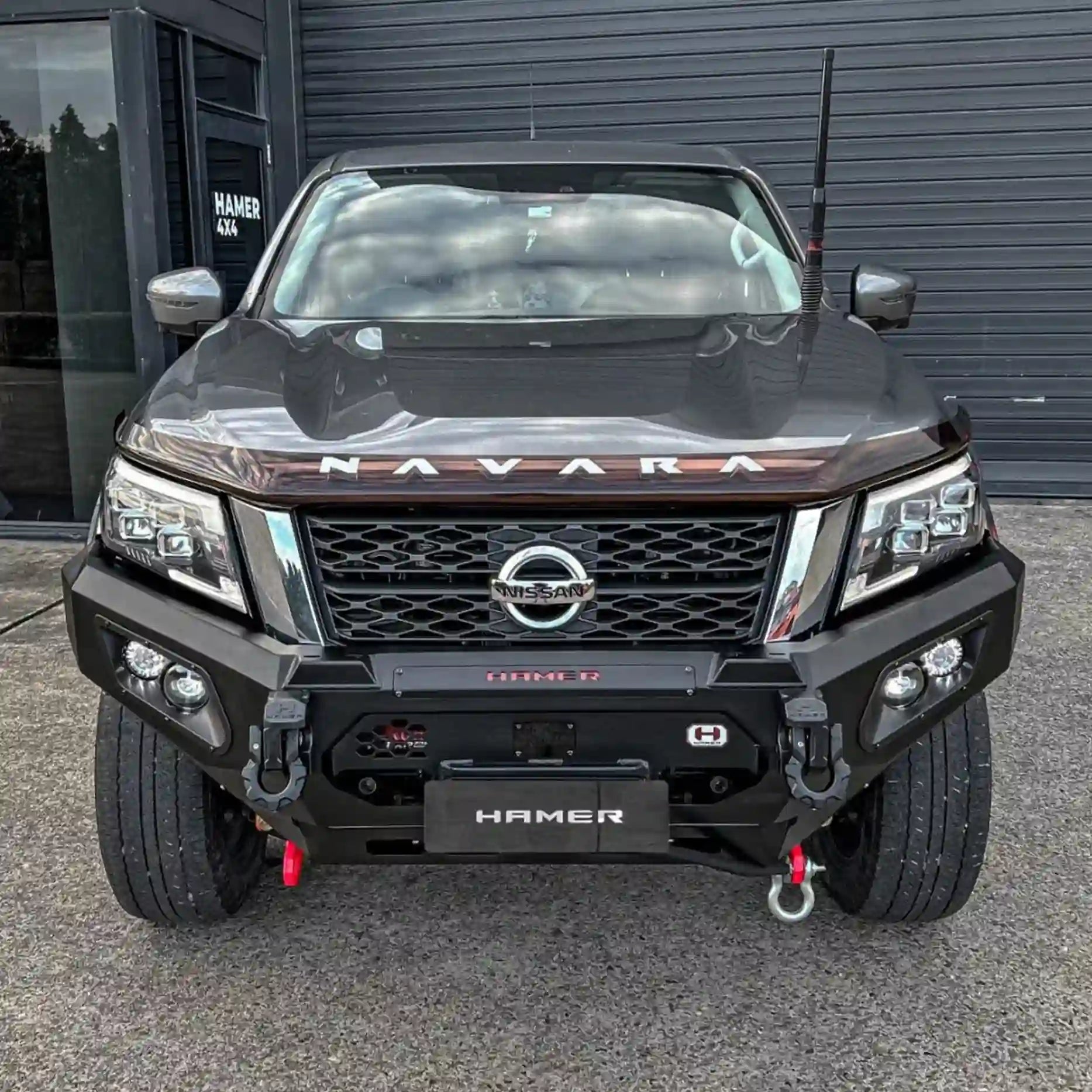 Rugged front angle shot of Nissan Navara (2021–Present) equipped with Hamer King Bull Bar, ADR compliant with winch compatibility and sleek integration.
