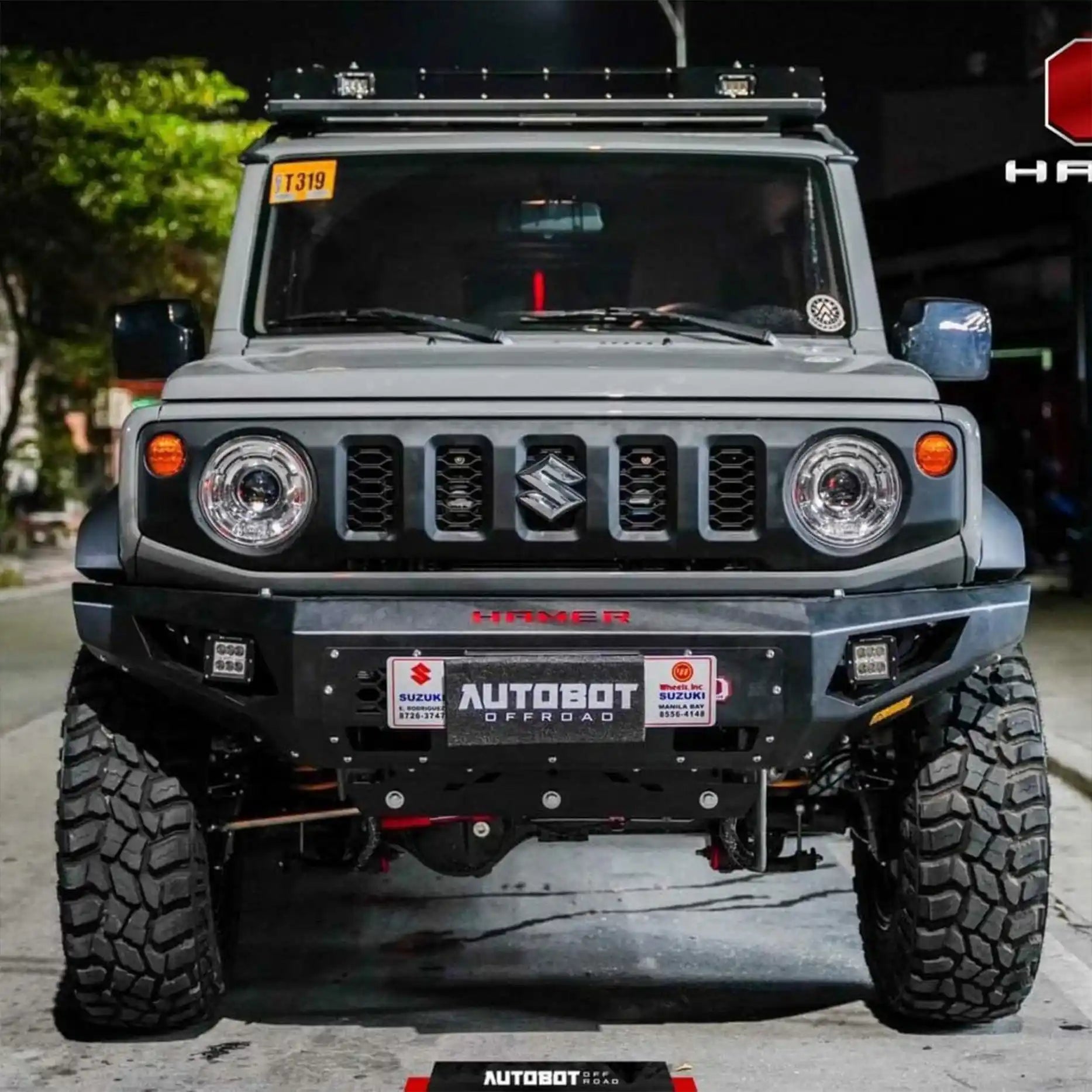 Front view of Suzuki Jimny XL 2023 with Hamer King Series Bull Bar, matte black steel build with ADR compliance and LED lighting.