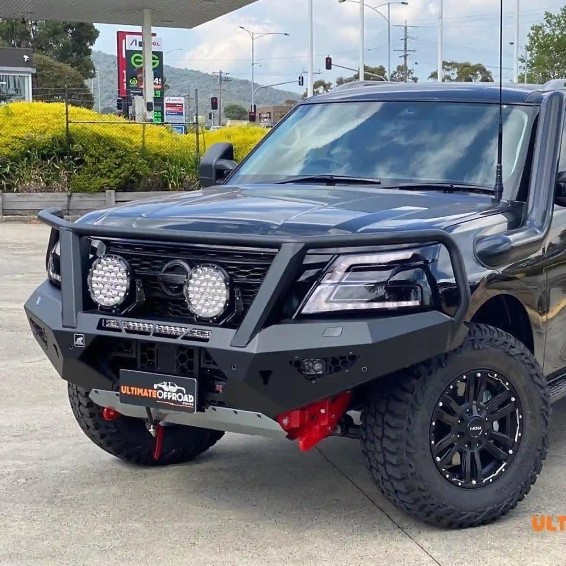 Left-angle view of the Offroad Animal Toro Bull Bar fitted to a Nissan Patrol Y62 Series 5, showing its aggressive contours and precision fitment. Built by Elevated 4x4, this ADR-compliant bull bar improves approach angles and offers a perfect platform for winches, driving lights, and antennas.