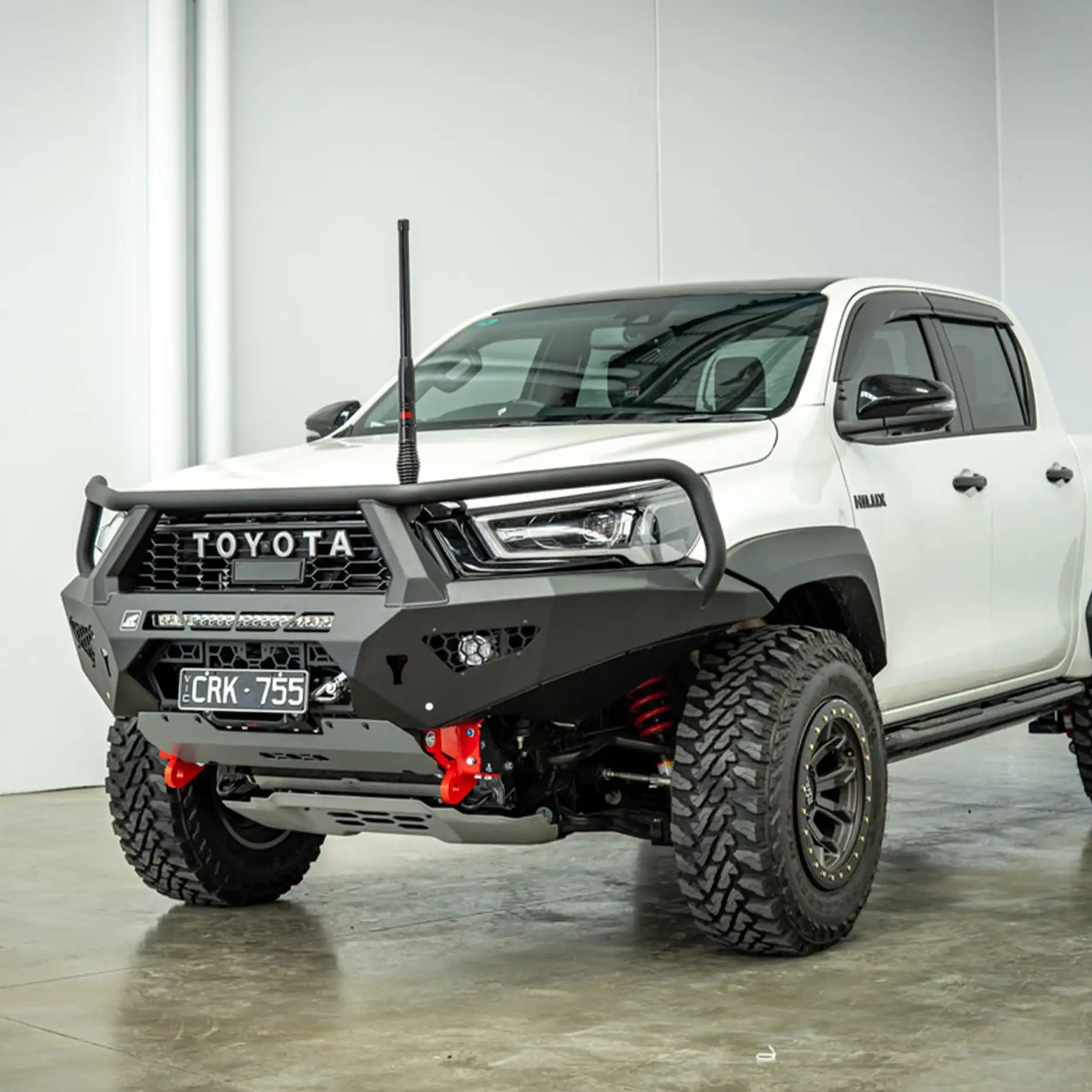 Left-angle view of the Offroad Animal Toro Bull Bar on a Toyota Hilux GR Sport, featuring its wide-body stance and tough matte-black finish. Elevated 4x4 delivers a sleek yet powerful look with full winch compatibility, advanced airflow, and recovery-ready strength for demanding off-road conditions.