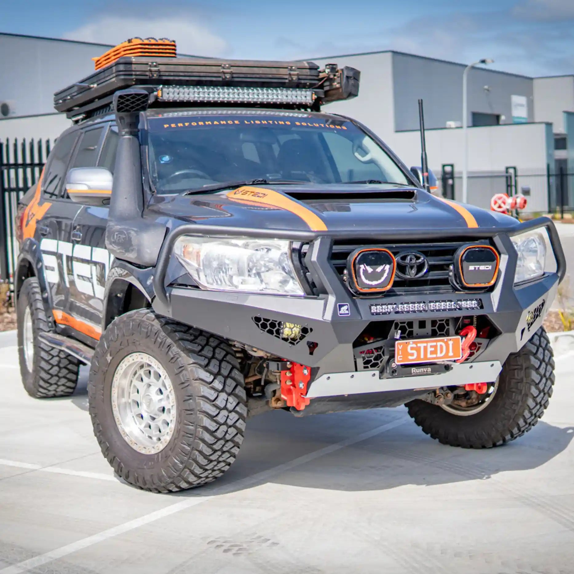 Right-angle view of the Offroad Animal Toro Bull Bar on a Toyota Land Cruiser 200 Series, highlighting its durable matte-black powder coat finish, welded one-piece structure, and integrated recovery points. Elevated 4x4’s superior design ensures lasting performance and a striking off-road appearance.