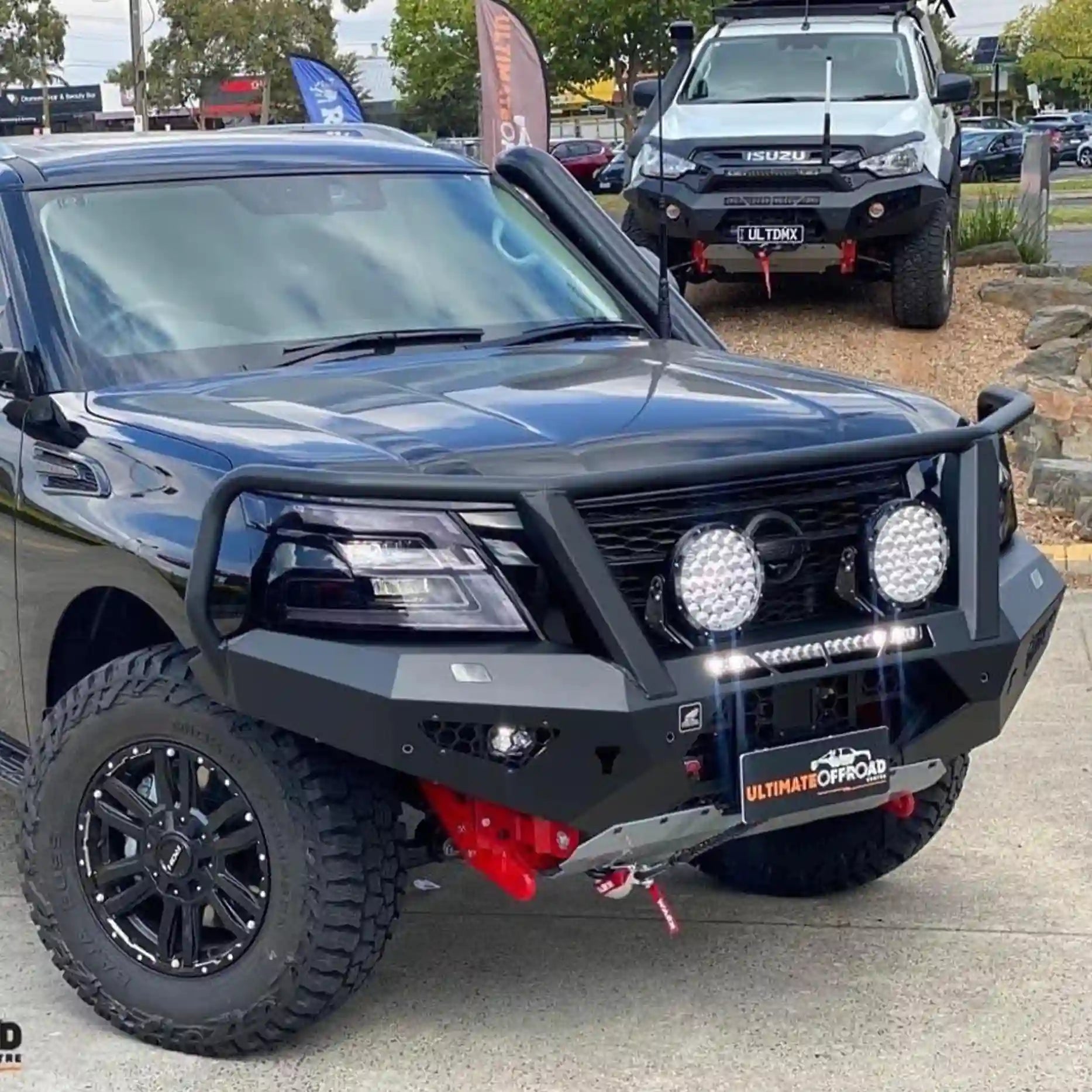 Right-side view of the Offroad Animal Toro Bull Bar installed on a Nissan Patrol Y62 Series 5, displaying its high-clearance profile and sleek matte black finish. Designed by Elevated 4x4 for superior airflow, toughness, and integration with factory sensors, it’s ideal for Australian off-road touring and 4WD performance.