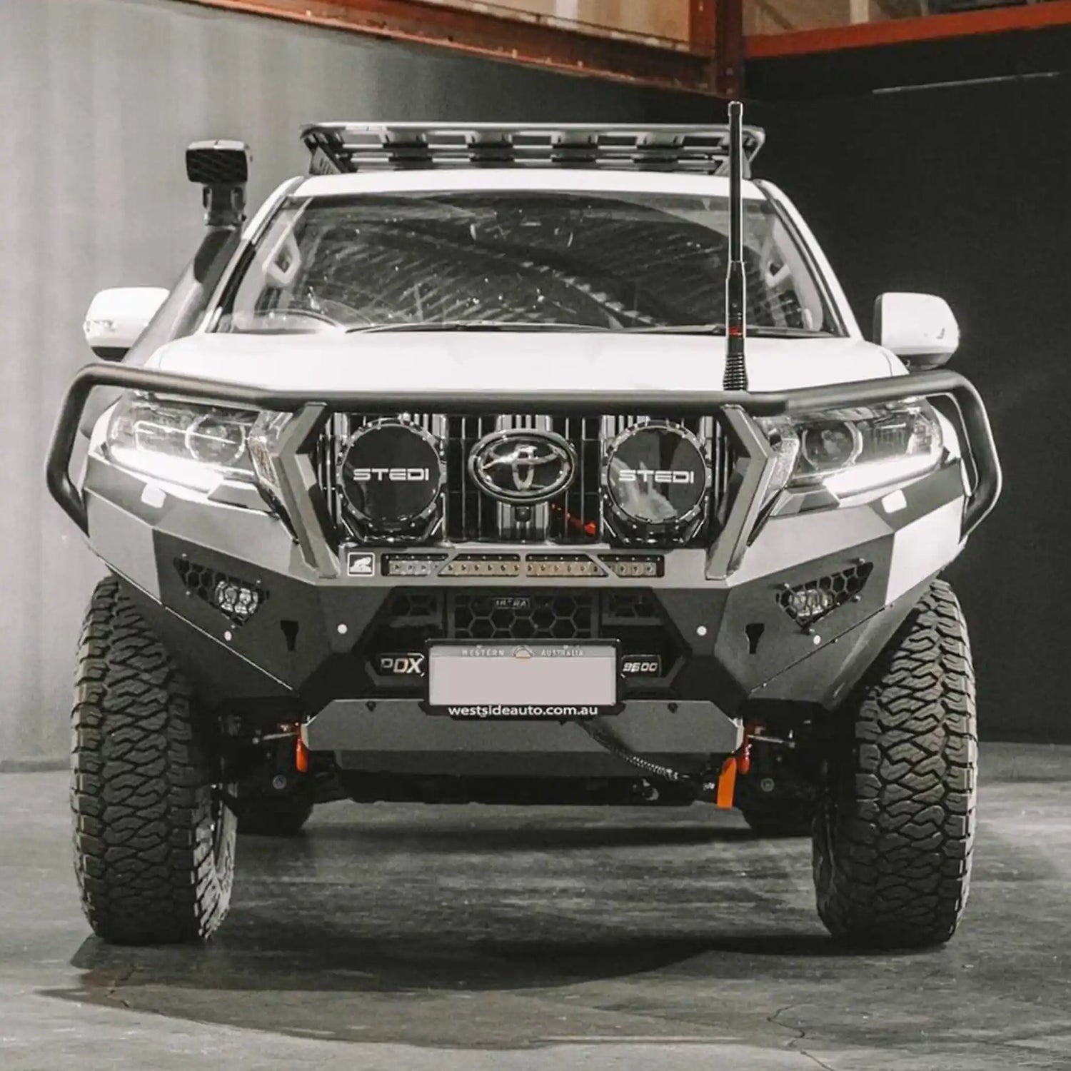 Detailed front view of the Offroad Animal Toro Bull Bar installed on a Toyota Prado 150 Series, highlighting its winch compatibility, recovery points, and strong steel design. Engineered and installed by Elevated 4x4, this bar blends rugged capability with sleek design for tough terrain driving in Nelson Bay and the Central Coast.