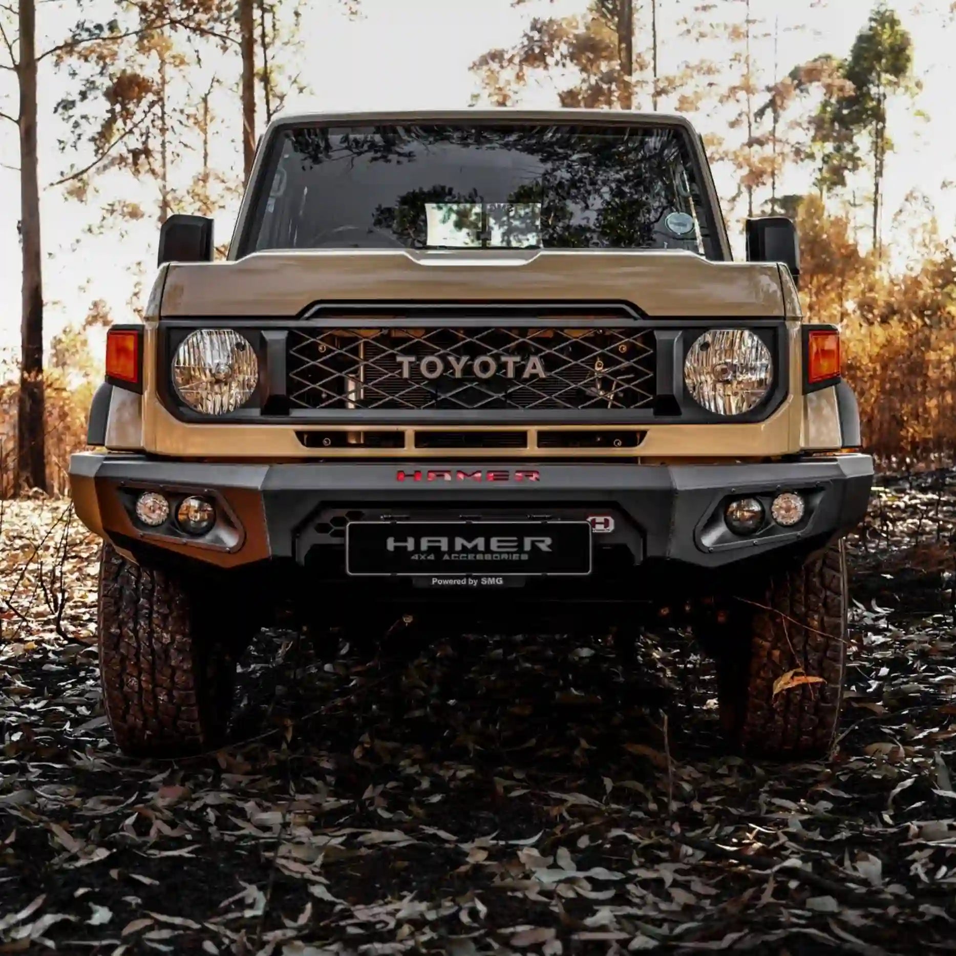 Angled front of Landcruiser 70 Series (2023–Present) showcasing Hamer King Bull Bar, sleek matte black finish with LED lighting system.