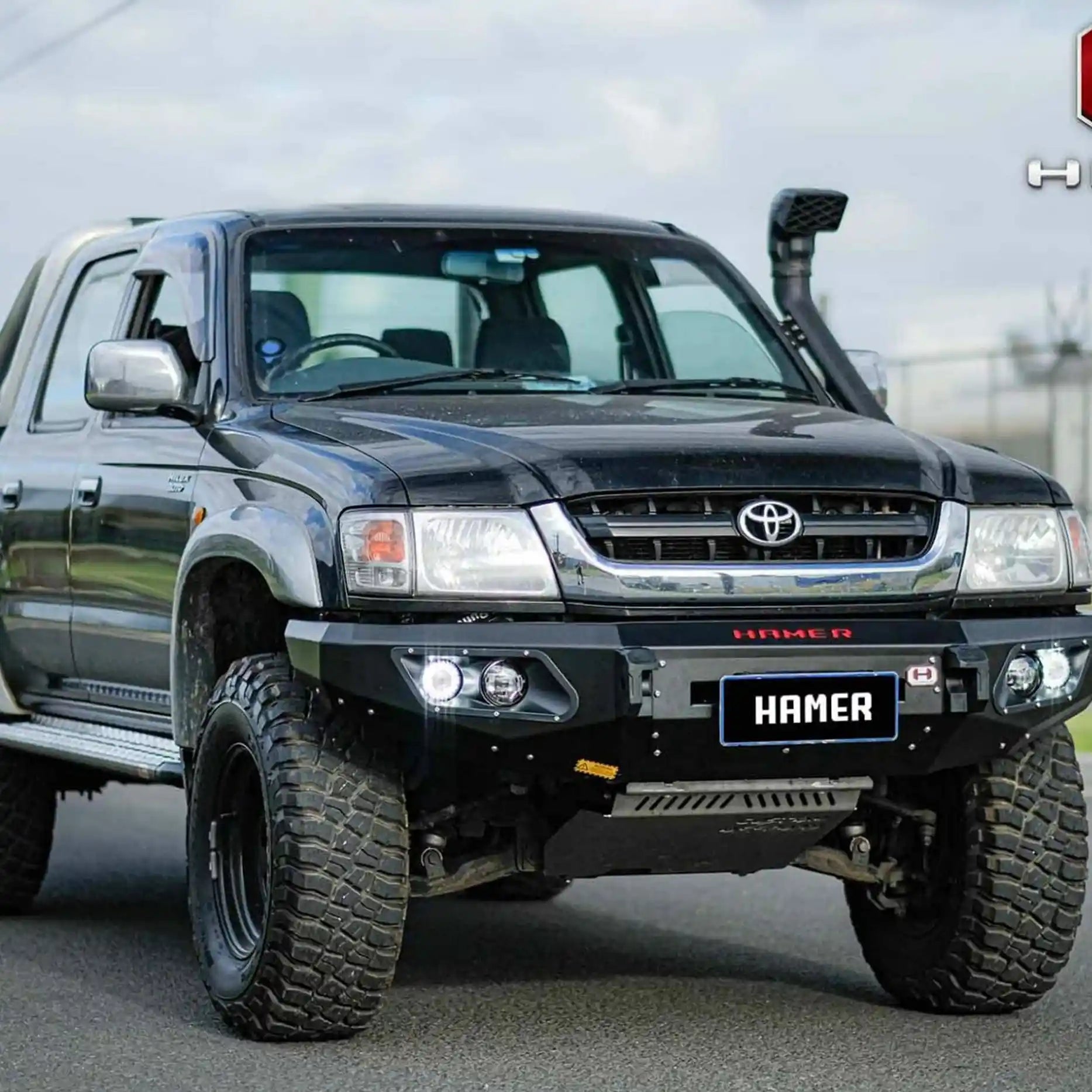 Left side of Hilux 1997–2005 showcasing Hamer King Bull Bar, sleek integrated fit, steel build with recovery points and mounts.
