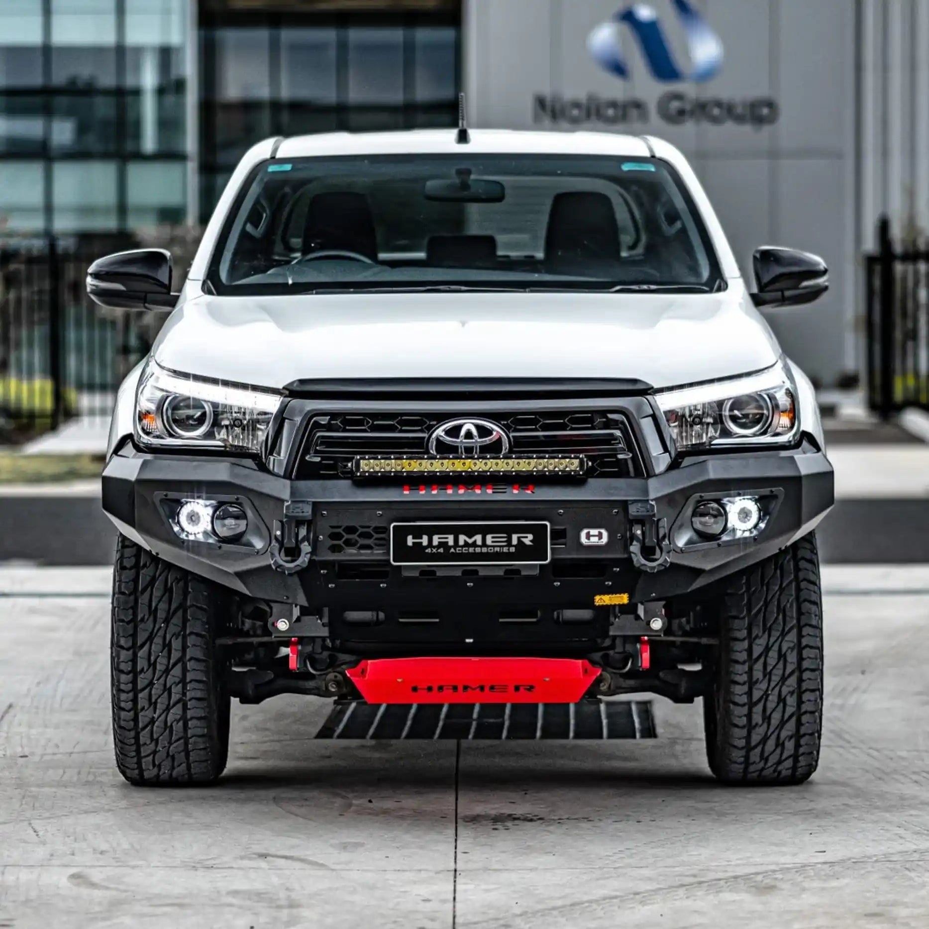 Front view of Toyota Hilux (2018–2020) with Hamer King Bull Bar, matte black steel, ADR compliant with winch compatibility.