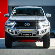 Front view of Toyota Hilux (2020–2023) with Hamer King Bull Bar, matte black steel design, ADR compliant with winch compatibility.
