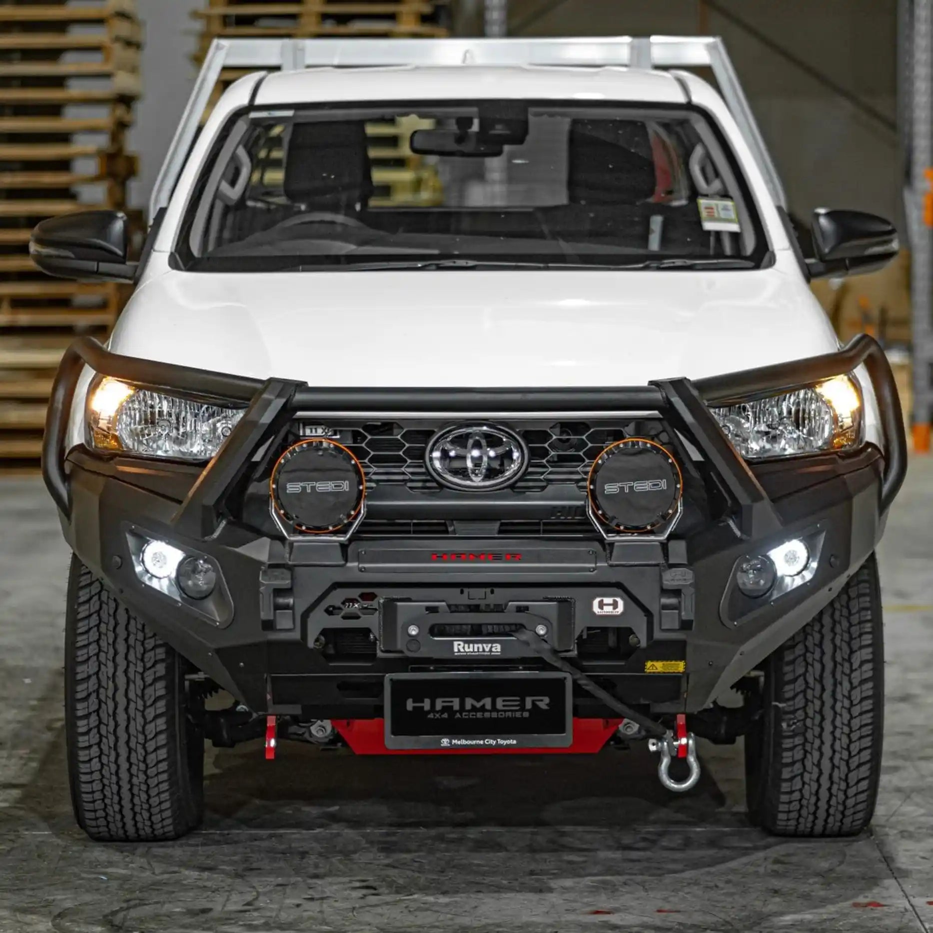 Front view of Toyota Hilux 2024 with Hamer King Series Plus Bull Bar, triple loop matte black steel, ADR compliant and winch compatible.