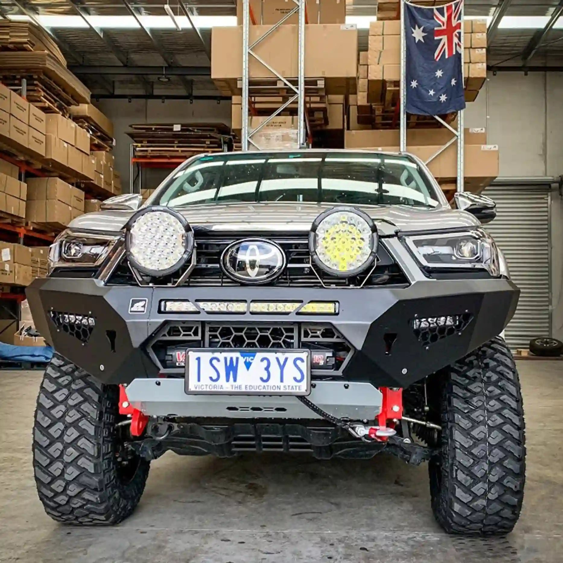 Front view of the Offroad Animal Predator Bull Bar on a Toyota Hilux N80 MY21, showcasing its aggressive stance and premium matte black finish. Engineered for airflow, winch compatibility, and rugged off-road strength, this bar from Elevated 4x4 enhances both the look and performance of your Hilux across Newcastle and the Hunter Valley.