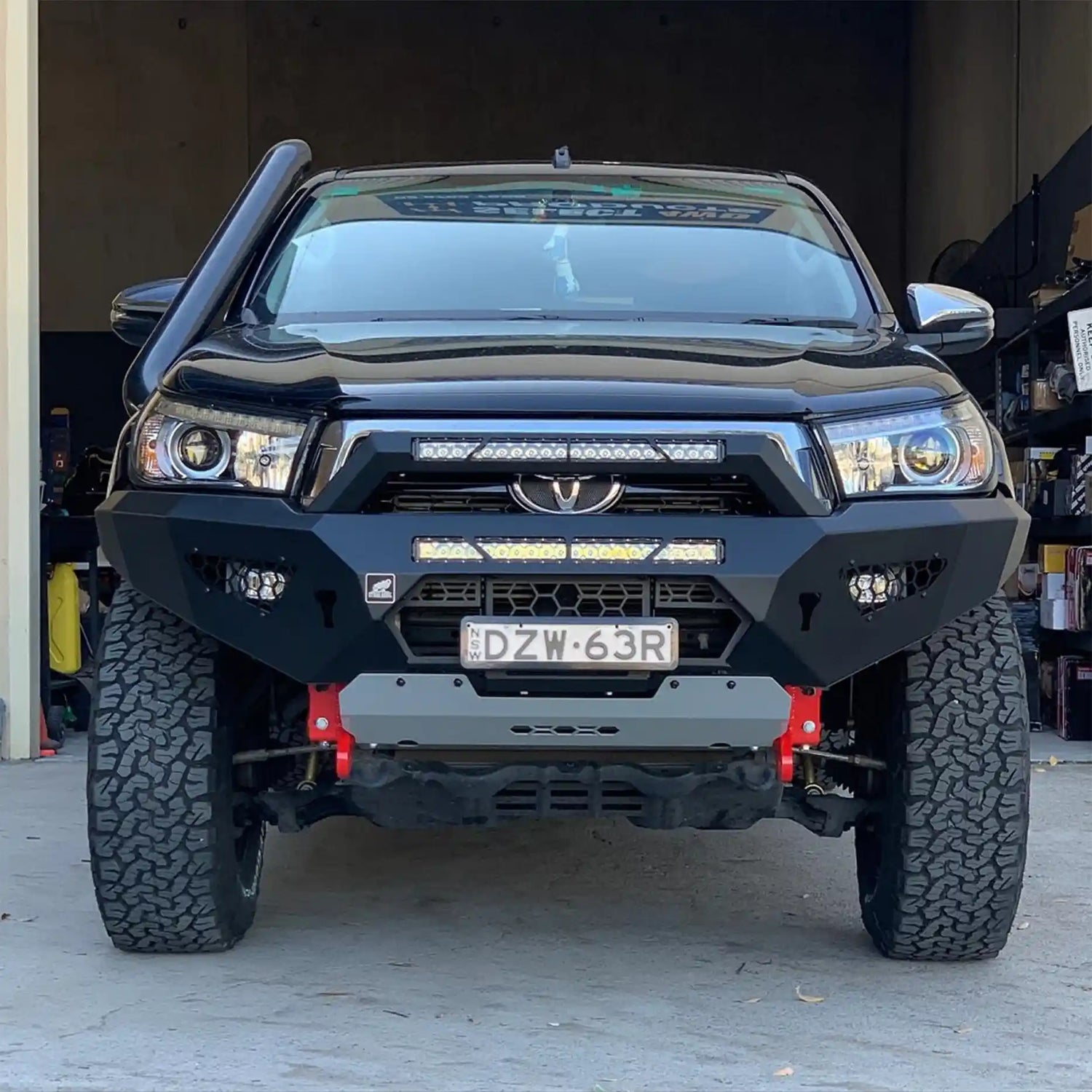 Front view of the Offroad Animal Predator Bull Bar installed on a Toyota Hilux N80, showcasing its bold, aggressive design and premium steel construction. Engineered by Elevated 4x4, this bull bar enhances protection and airflow while giving the Hilux a commanding off-road stance. Perfect for Newcastle, Maitland, and Hunter Valley drivers looking for rugged style and performance.