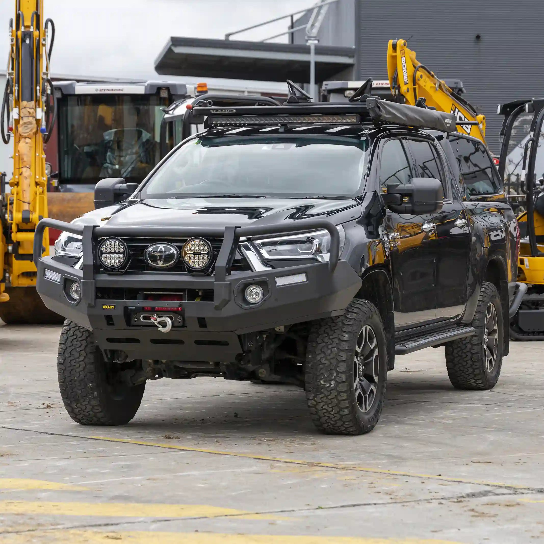 right installed oxley bull bar on toyota hilux highlighting slim profile and fog light integration elevated 4x4