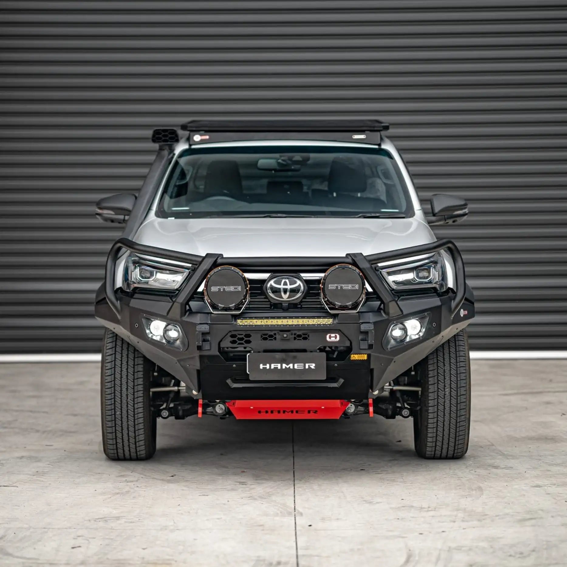 Toyota Hilux Rogue (2022–Present) with Hamer King Plus Bull Bar, heavy-duty steel build, recovery points, and light bar integration.