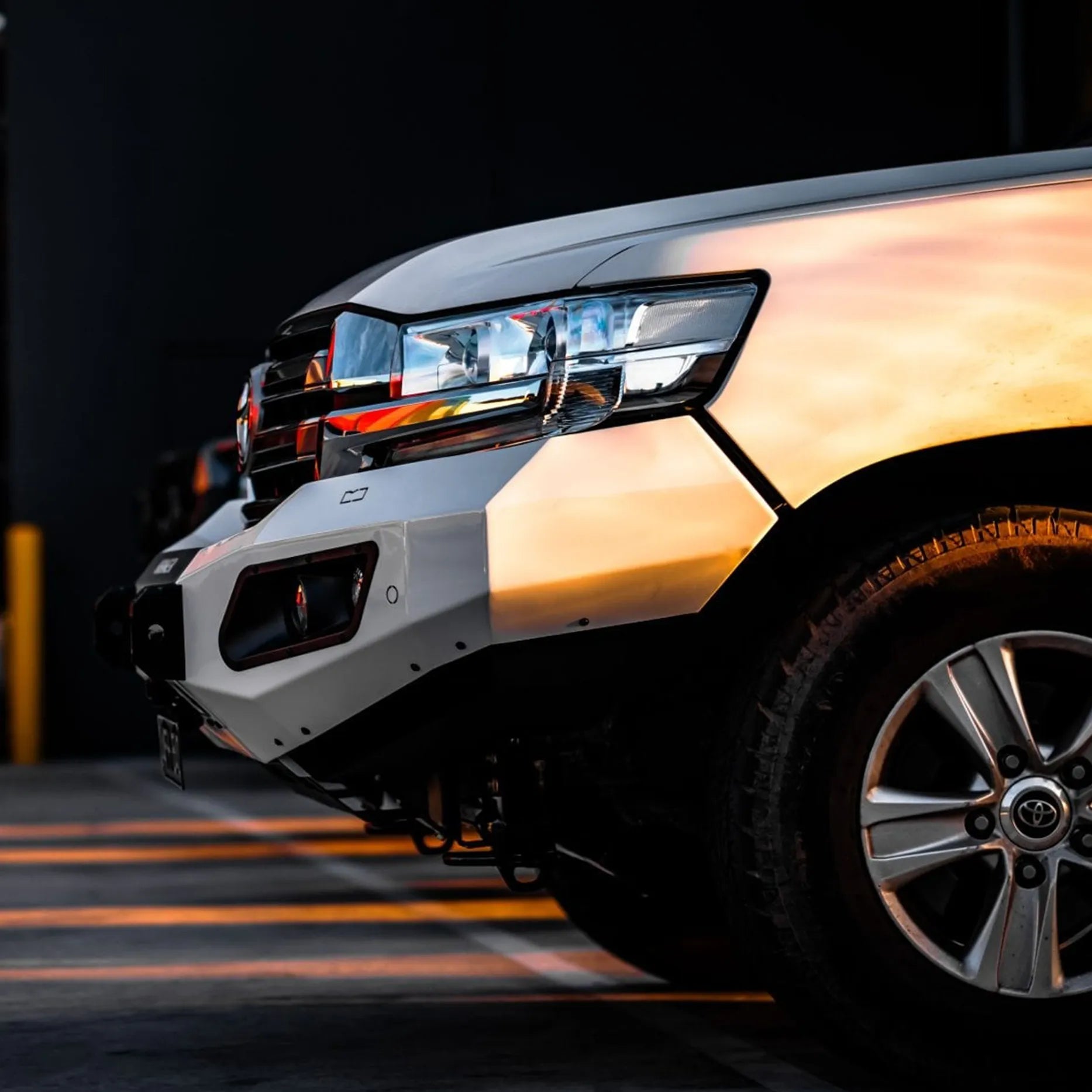 Right angle shot of Landcruiser 200 Series with Hamer King Bull Bar, tough 3 mm steel, LED lighting and matte finish for reliable off-road protection.