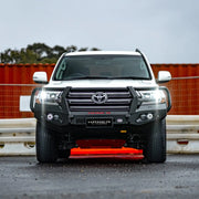 Front view of Landcruiser 200 with Hamer King Series Plus Bull Bar, matte black 3 mm steel bumper replacement with LED lights and winch access.