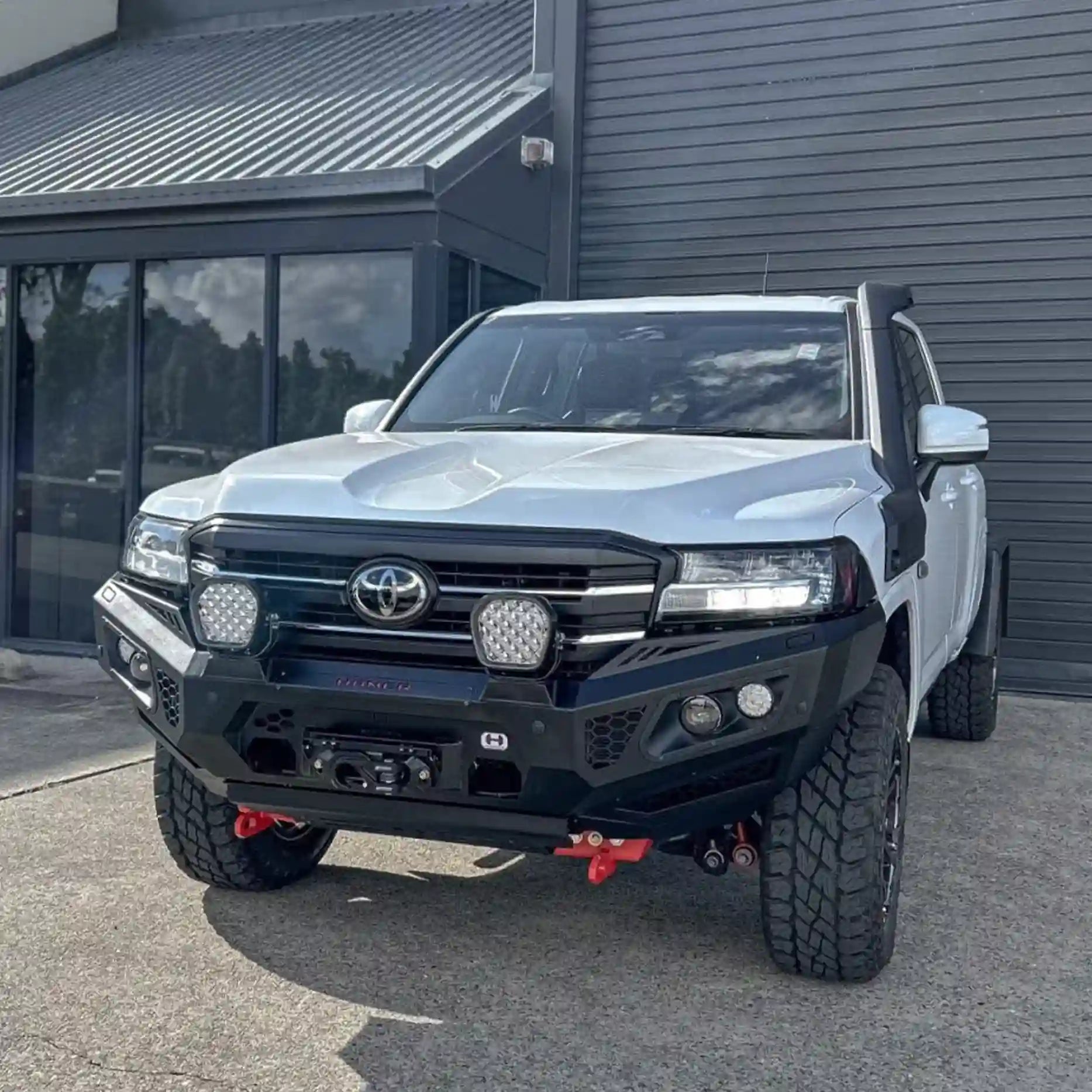 Right view of Landcruiser 300 with Hamer King Bull Bar, rugged 3mm steel, E-Mark LED lights, recovery points, and winch compatibility.