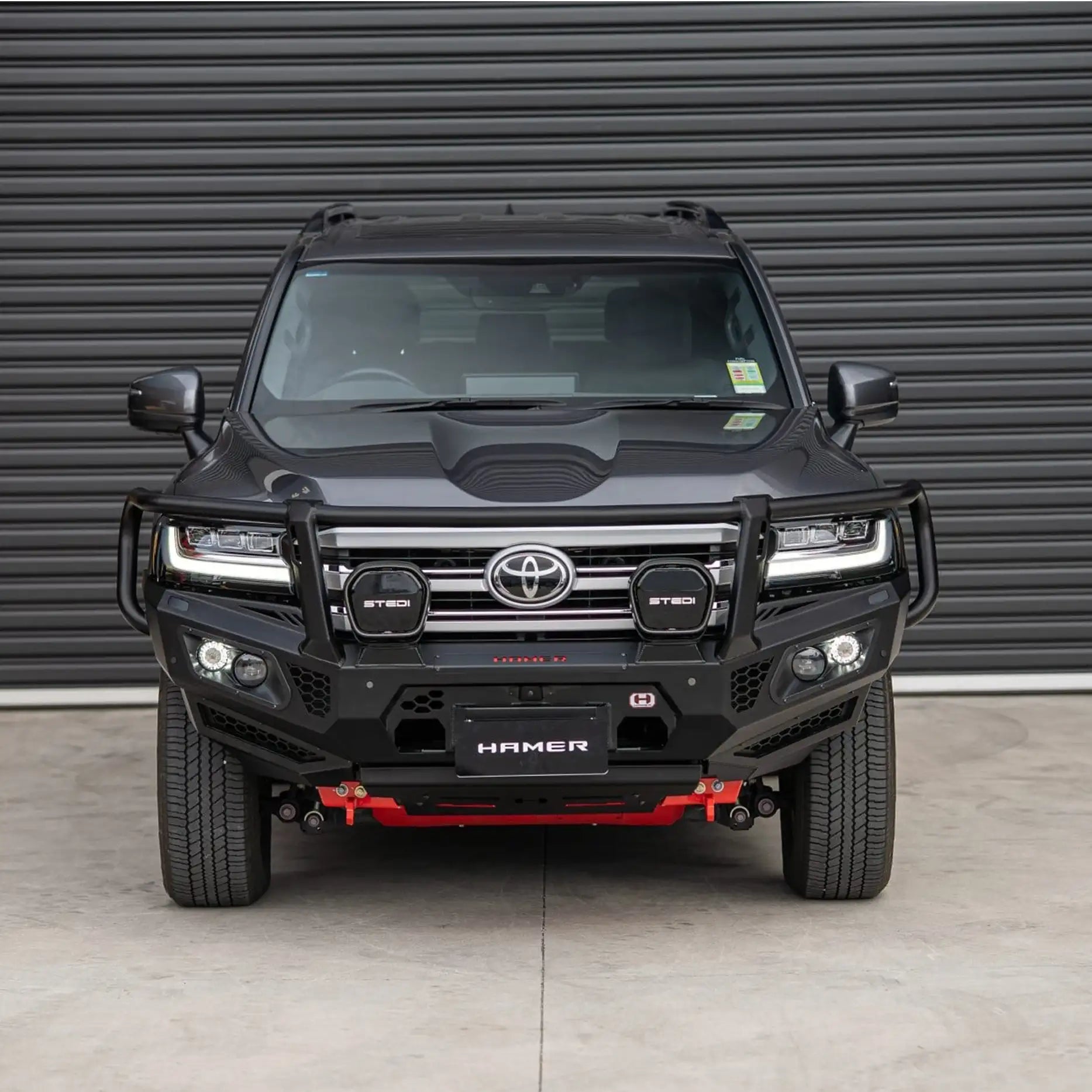 Front view of Landcruiser 300 with Hamer King Series Plus Bull Bar, 3mm steel, triple loop protection, ADR compliant, winch compatible.