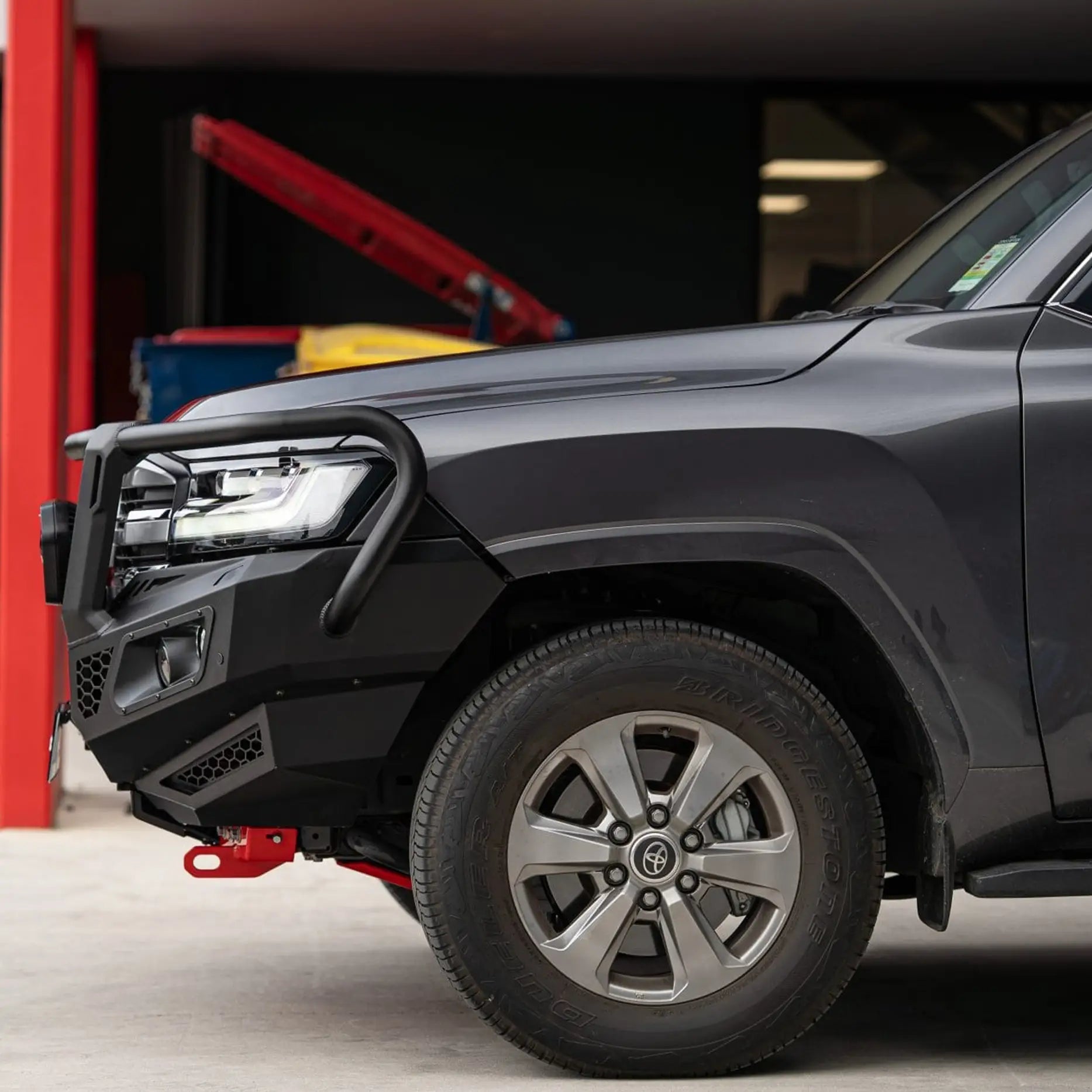 Right angled Landcruiser 300 showing Hamer King Series Plus Bull Bar, winch ready, ADR compliant, sleek integration with factory features.