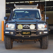 front installed oxley bull bar on toyota landcruiser 70 single cab showing adr compliant matte black design elevated 4x4