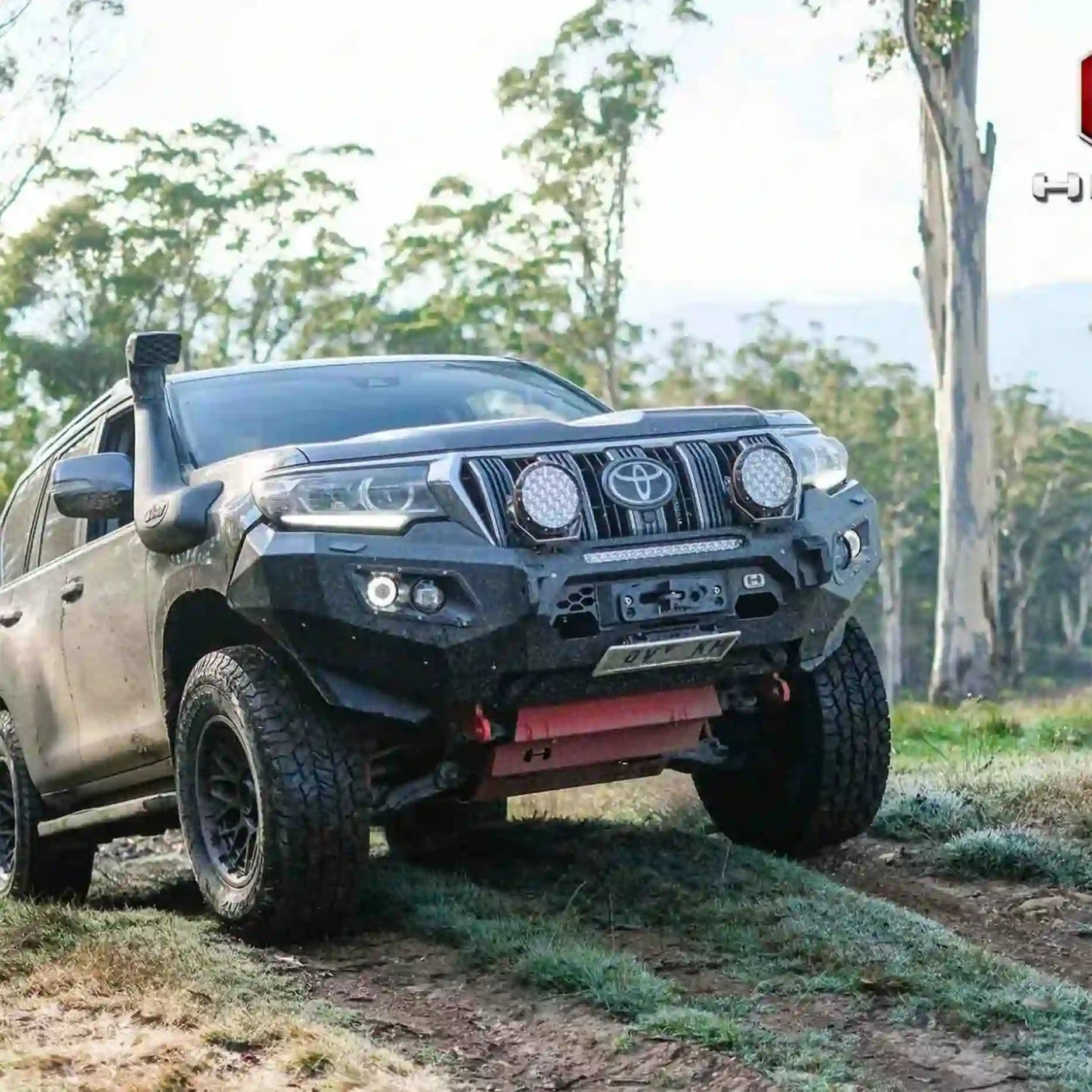 Left side view of Prado 150 fitted with Hamer King Bull Bar, featuring recovery points and factory sensor compatibility.