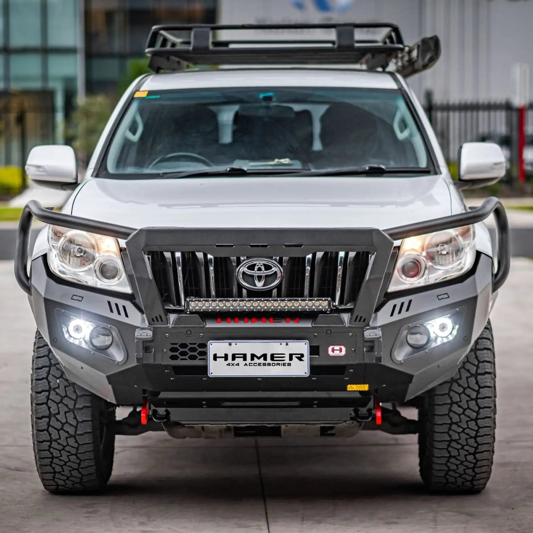 Front view of Hamer King Plus Bull Bar for Toyota Prado 150 Series (2009–2013), heavy-duty bumper replacement with matte black finish.