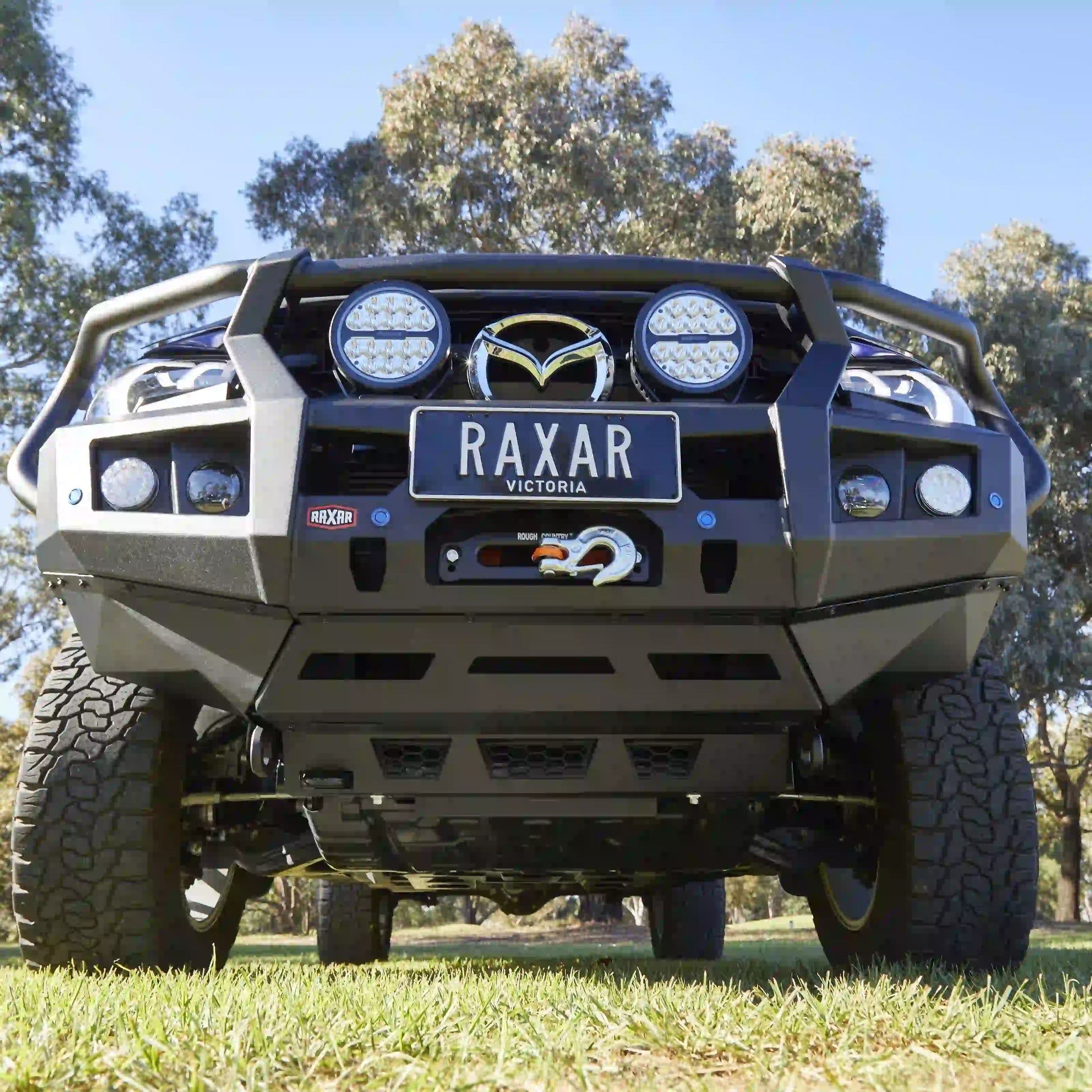 underside view of mazda bt50 2025 with raxar looped bull bar highlighting four piece underbody protection plates split pan airflow system and reinforced inner wing braces engineered for durability reliability and strength in australian offroad conditions supplied by elevated 4x4
