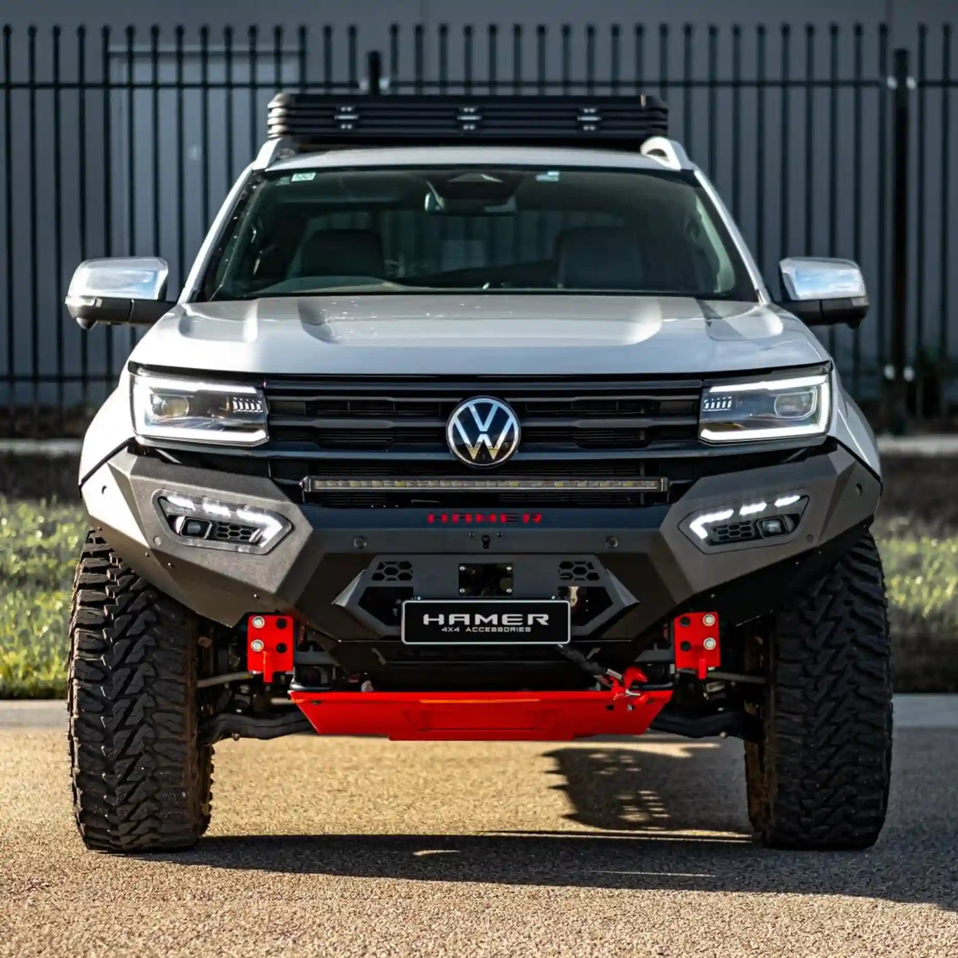 Front view of Volkswagen Amarok (2023 – Present) with Hamer Atlas Series Bull Bar, matte black finish, ADR compliant, featuring integrated LED fog lamps, DRLs, and winch compatibility.