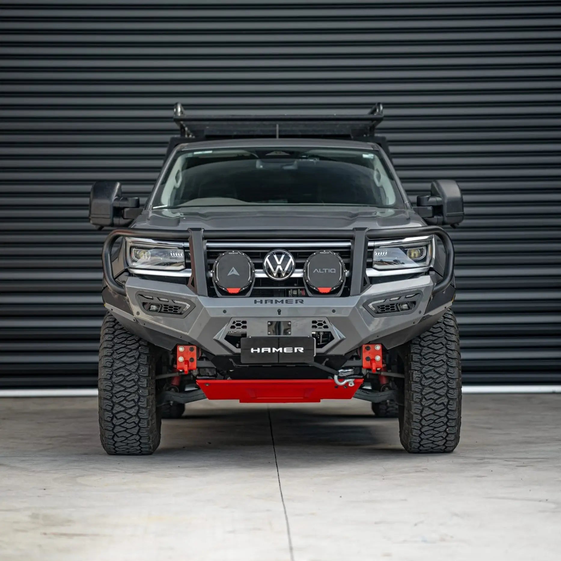 Front view of Volkswagen Amarok (2023 – Present) fitted with Hamer Atlas Series Plus Bull Bar in matte black finish, ADR compliant, featuring integrated LED fog lamps, DRLs, and winch compatibility.